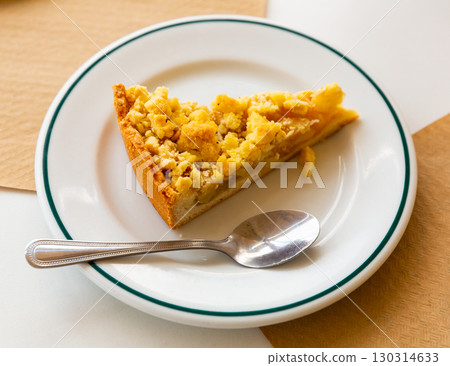 Piece of fresh apple pie on plate 130314633