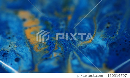 Ripple paint. Shiny fluid. Blur blue yellow color water texture dust ink bubble spreading on abstract creative acrylic background. Ripple paint. Shiny fluid. Blur blue yellow color water texture dust ink bubble spreading on abstract creative acrylic background. 130314797