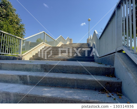 Concrete stairs with metal railings 130314936