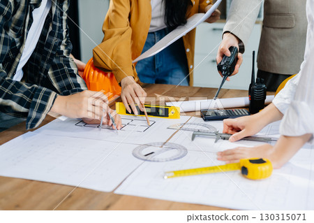 Engineer Teamwork Meeting, Drawing working on blueprint meeting for project working with partner on model building 130315071
