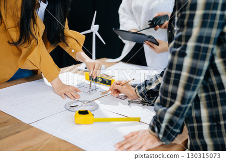 Engineer Teamwork Meeting, Drawing working on blueprint meeting for project working with partner on model building 130315073