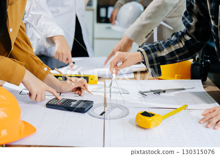 Engineer Teamwork Meeting, Drawing working on blueprint meeting for project working with partner on model building 130315076