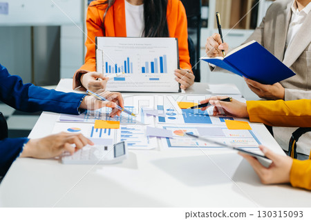 Business team meeting present.professional investor working with Finance managers task. with laptop smart phone Business team meeting present.professional investor working with Finance managers task. with laptop smart phone 130315093