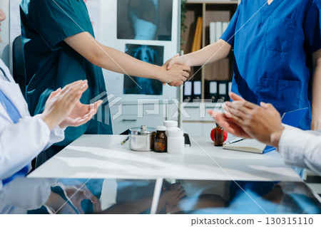Doctor handshake and partnership in healthcare, medicine or trust for collaboration, unity or support.Team of medical experts shaking hands in teamwork 130315110