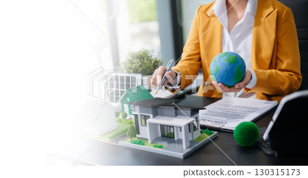 balancing the property sector The real estate agent is explaining the house style to see the house design and the purchase agreement. model house and comdo balancing the property sector The real estate agent is explaining the house style to see the house design and the purchase agreement. model house and comdo 130315173