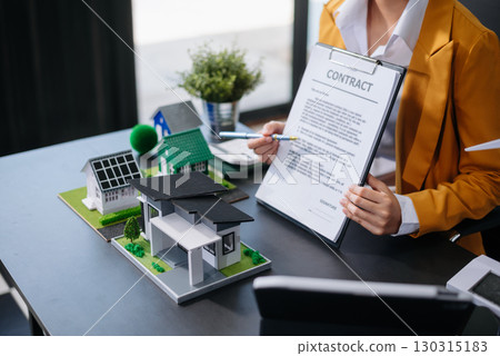 balancing the property sector The real estate agent is explaining the house style to see the house design and the purchase agreement. model house and comdo balancing the property sector The real estate agent is explaining the house style to see the house design and the purchase agreement. model house and comdo 130315183