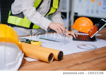usiness people having consultation about wind energy at company office. on architectural project site and making model house. 130315198