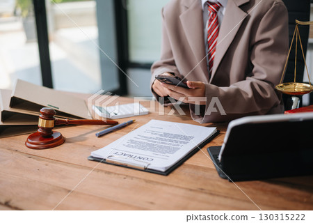 justice and law concept.law the desk, books, balance. male judge in a courtroom the gavel,working with digital tablet, smartphone 130315222