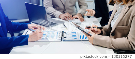 Business team collaboration discussing working analyzing with financial data and marketing growth report graph 130315277