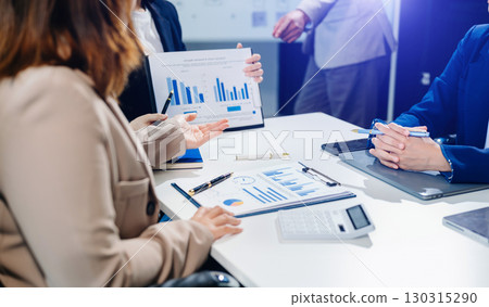 Business team meeting. professional investor working new start up project. Finance task. with smart phone and laptop 130315290