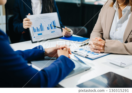 Business team meeting. professional investor working new start up project. Finance task. with smart phone and laptop Business team meeting. professional investor working new start up project. Finance task. with smart phone and laptop 130315291