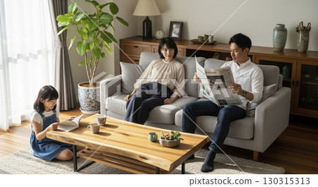 Family gathering relaxing in the living room 130315313