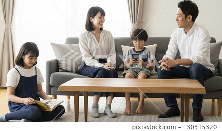 Family gathering relaxing in the living room Family gathering relaxing in the living room 130315320