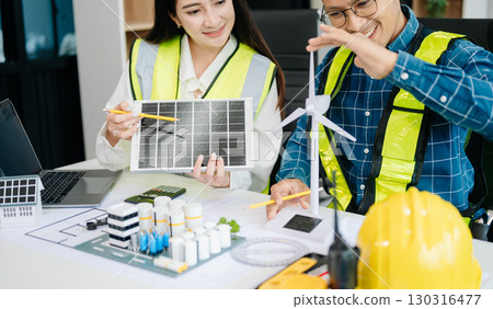 usiness people having consultation about wind energy at company office. on architectural project site and making model house usiness people having consultation about wind energy at company office. on architectural project site and making model house 130316477
