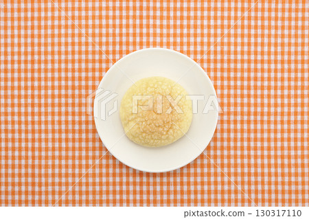 Melon bread on a white plate Melon bread on a white plate 130317110