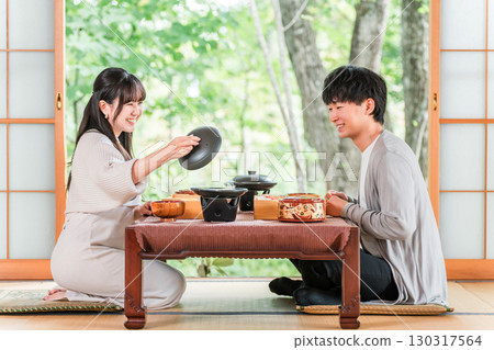 Married couples and couples enjoying kaiseki cuisine at a ryokan (in-room dining, kaiseki cuisine, set menu, luxury) Married couples and couples enjoying kaiseki cuisine at a ryokan (in-room dining, kaiseki cuisine, set menu, luxury) 130317564