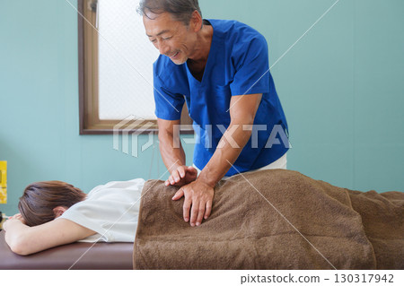 Osteopathic doctor and patient 130317942