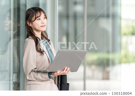 Stylish woman/designer/businesswoman with a laptop 130318004