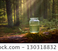 An image of a glass jar filled with a glowing greenish liquid, sitting on a mossy fallen tree in the forest. The sunbeams are shining through the trees, creating a magical and mystical atmosphere. The 130318832