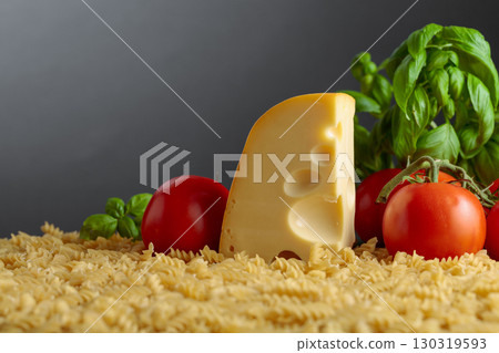 Ingredients for preparing traditional Italian pasta with cheese. 130319593