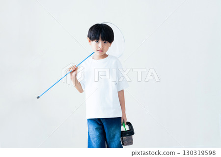 Boy holding a butterfly net Boy holding a butterfly net 130319598