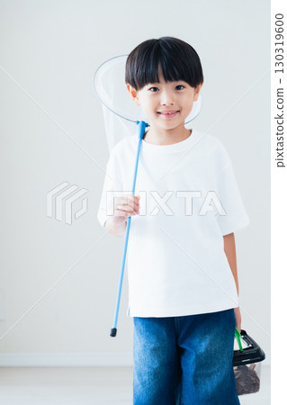 Boy holding a butterfly net 130319600