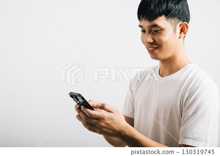 Portrait Asian smiling young man using mobile phone cellphone for social media studio isolated white background, Happy lifestyle men typing message on smartphone, mobile application online Portrait Asian smiling young man using mobile phone cellphone for social media studio isolated white background, Happy lifestyle men typing message on smartphone, mobile application online 130319745