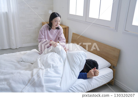 A wife waking up her husband in the morning A wife waking up her husband in the morning 130320207