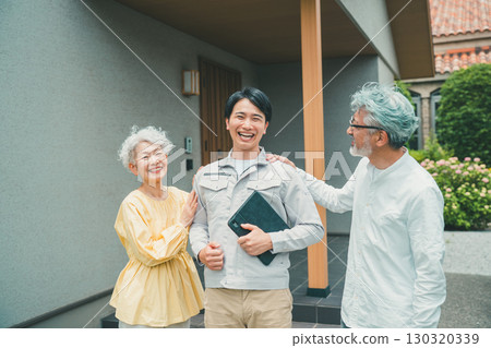 A reliable housing salesman and a senior couple A reliable housing salesman and a senior couple 130320339