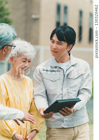 Housing salesman and senior couple 130320462