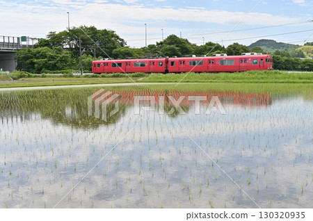 Meitetsu Hiromi Line 6000 series train 6012 travels through rice fields Meitetsu Hiromi Line 6000 series train 6012 travels through rice fields 130320935