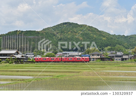 Meitetsu Hiromi Line 6000 series train 6012 travels through the tranquil rice fields of Mitake Meitetsu Hiromi Line 6000 series train 6012 travels through the tranquil rice fields of Mitake 130320937