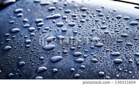 Image of water droplets and a water-repellent car hood (blue) 130321604