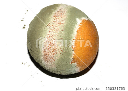 Fruit mould and spores on an over ripe rotten orange Fruit mould and spores on an over ripe rotten orange 130321763
