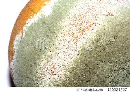 Fruit mould and spores on an over ripe rotten orange Fruit mould and spores on an over ripe rotten orange 130321767