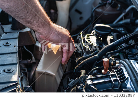 Engine oil check before car journey for safety travel 130322097