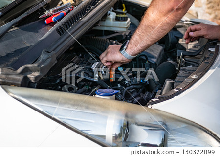Engine oil check before car journey for safety travel 130322099