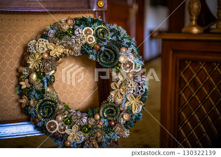 Christmas wreath decoration on a wooden door Christmas wreath decoration on a wooden door 130322139