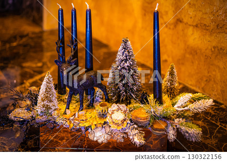 Christmas table composition. Beautiful decoration. Christmas trees, candles, stars, lights and elegant accessories. Merry Christmas and Happy Holidays, Template. 130322156