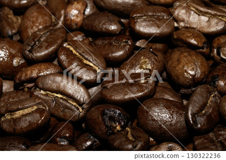 Close up of dark roasted coffee beans deep brown and tasty close up Close up of dark roasted coffee beans deep brown and tasty close up 130322236