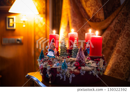 Christmas table composition. Beautiful decoration. Christmas trees, candles, stars, lights and elegant accessories. Merry Christmas and Happy Holidays, Template. 130322392