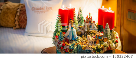 Christmas table composition. Beautiful decoration. Christmas trees, candles, stars, lights and elegant accessories. Merry Christmas and Happy Holidays, Template. 130322407