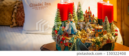 Christmas table composition. Beautiful decoration. Christmas trees, candles, stars, lights and elegant accessories. Merry Christmas and Happy Holidays, Template. 130322408