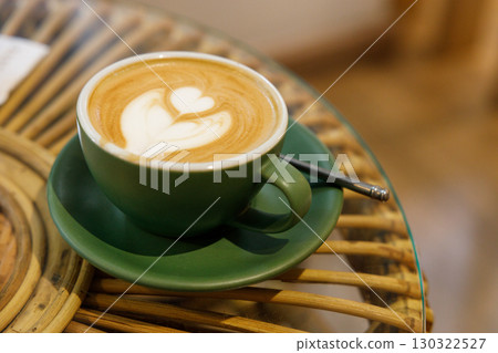 Cup of hot milk latte coffee and piccolo latte coffee on table by the window. 130322527