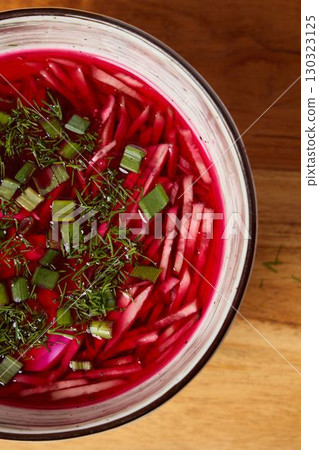 Vibrant and Colorful Beetroot Salad Accompanied by Fresh Herbs and Flavorful Onions 130323125