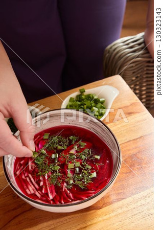 A Stunningly Vibrant Beetroot Soup Enhanced with Fresh Herbs and Greens for Flavor 130323143
