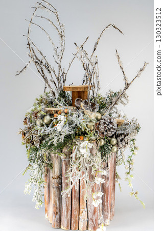 Christmas table composition. Beautiful decoration. Christmas trees, candles, stars, lights and elegant accessories. Merry Christmas and Happy Holidays, Template. 130323512