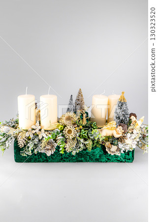 Christmas table composition. Beautiful decoration. Christmas trees, candles, stars, lights and elegant accessories. Merry Christmas and Happy Holidays, Template. 130323520