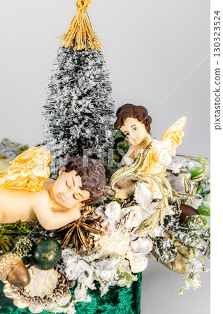 Christmas table composition. Beautiful decoration. Christmas trees, candles, stars, lights and elegant accessories. Merry Christmas and Happy Holidays, Template. Christmas table composition. Beautiful decoration. Christmas trees, candles, stars, lights and elegant accessories. Merry Christmas and Happy Holidays, Template. 130323524