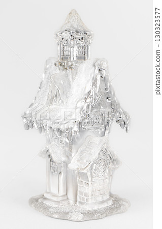 Glass christmas figurine of a house with snow. christmas Composition on gray background. Home sweet home christmas concept 130323577